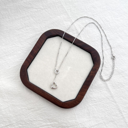 Detail of adjustable chain and clasp on 925 Sterling Silver heart charm necklace.